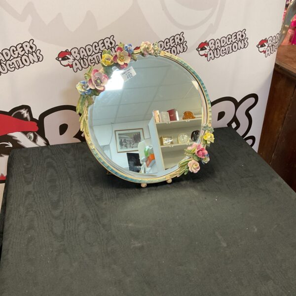 Vintage floral barbola mirror with sculpted details.