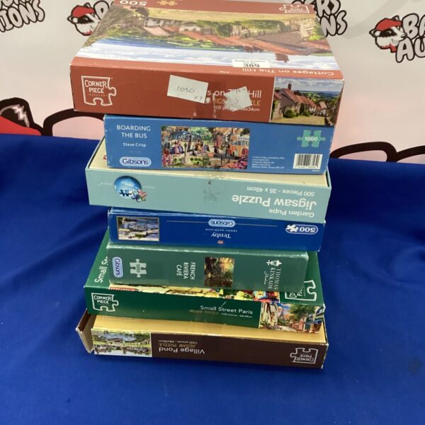 Vintage jigsaw puzzles lot with corner piece for collectors.