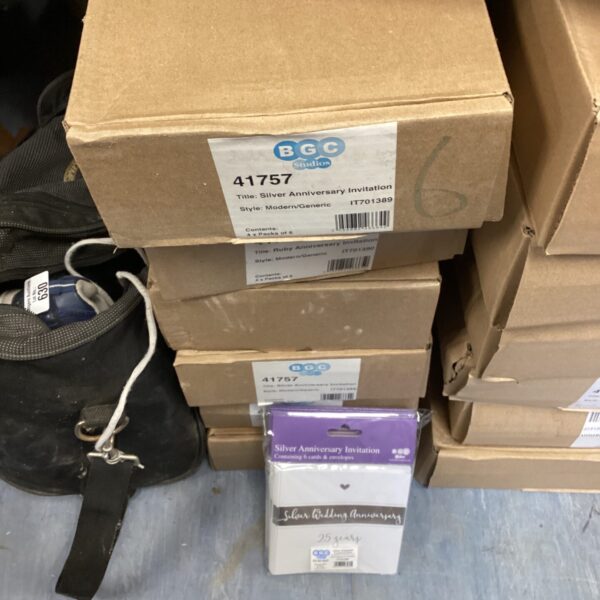 Stack of six boxes of BGC silver anniversary invitations.