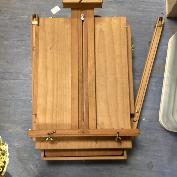 Vintage Windsor & Newton folding artist easel with storage compartment.
