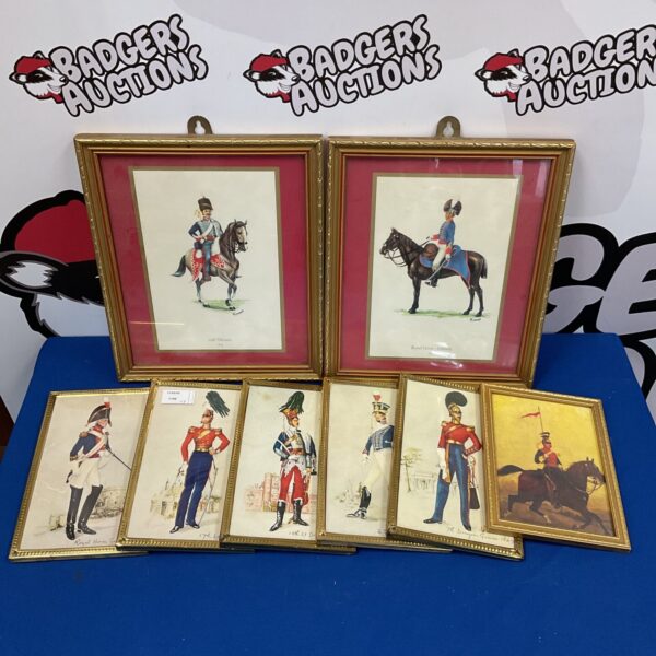 Framed military dress prints showcasing historical regimental uniforms.