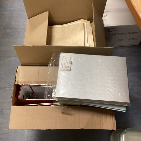 New stationery bundle with ring binders, coloured paper, and envelopes.