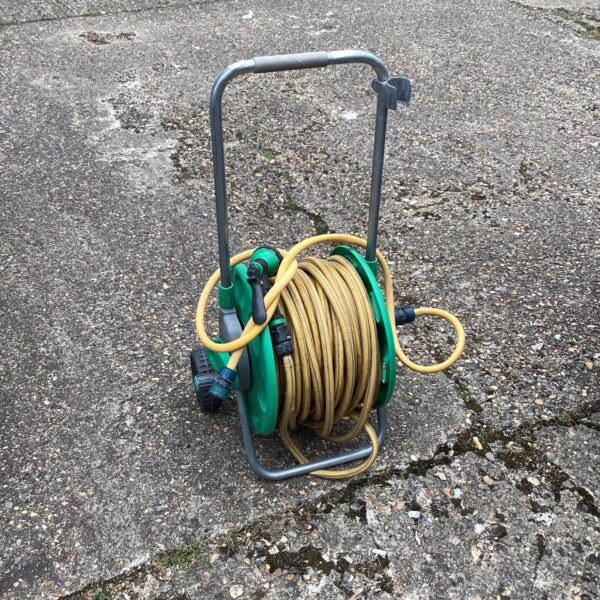 Brightly coloured Hozlock garden hose reel with yellow hose.