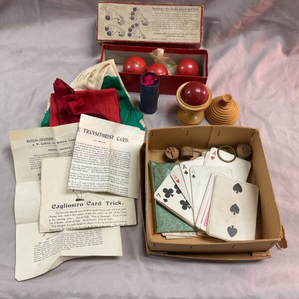 Vintage magic trick set box with colourful lithograph.