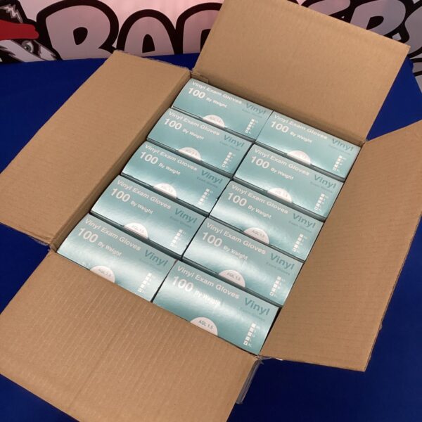 Stack of ten boxes of new XL vinyl exam gloves.