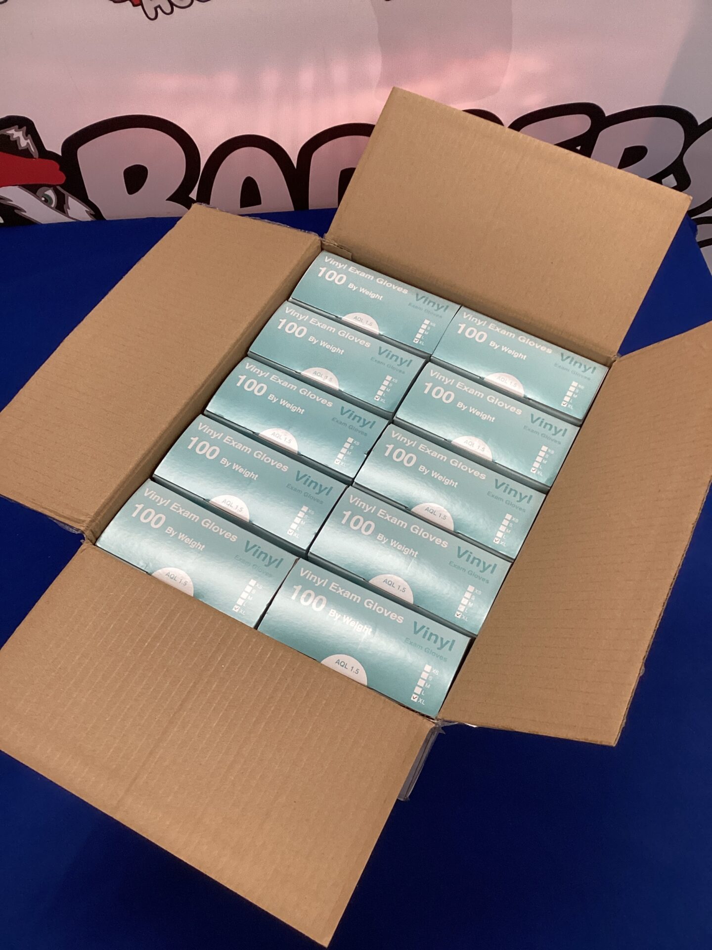 635 Ten boxes of new XL vinyl exam gloves