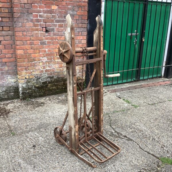 Vintage sack lifter barrow with chain mechanism.