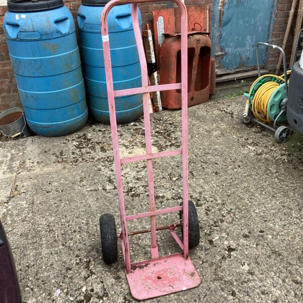 Vintage metal sack barrow needing repair for garden or DIY use.