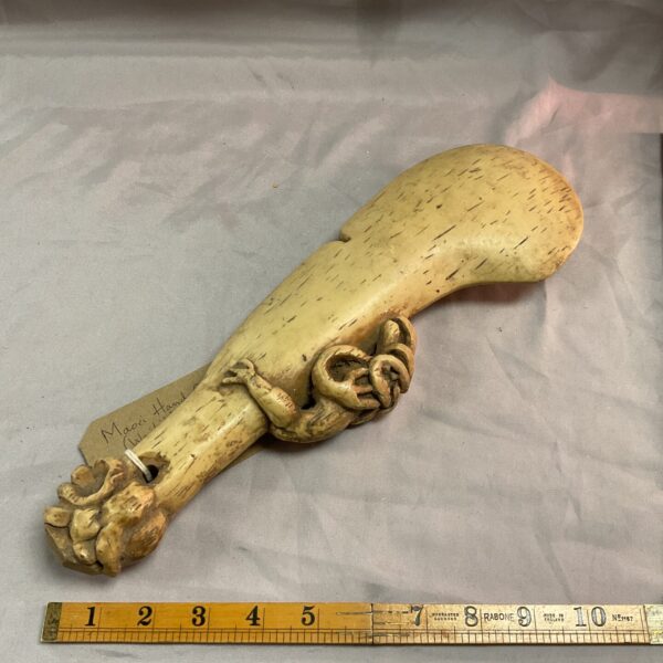 Antique Māori wahaika whalebone club with carved handle.