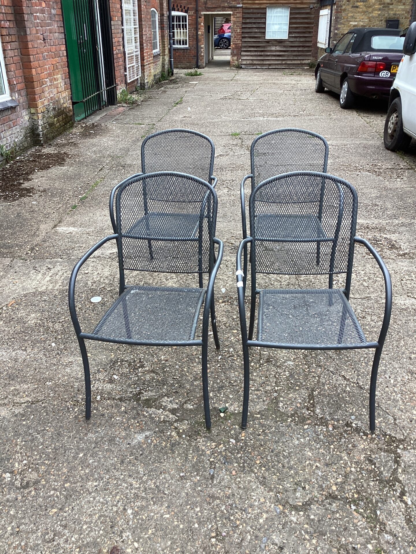 1077 Four metal garden chairs