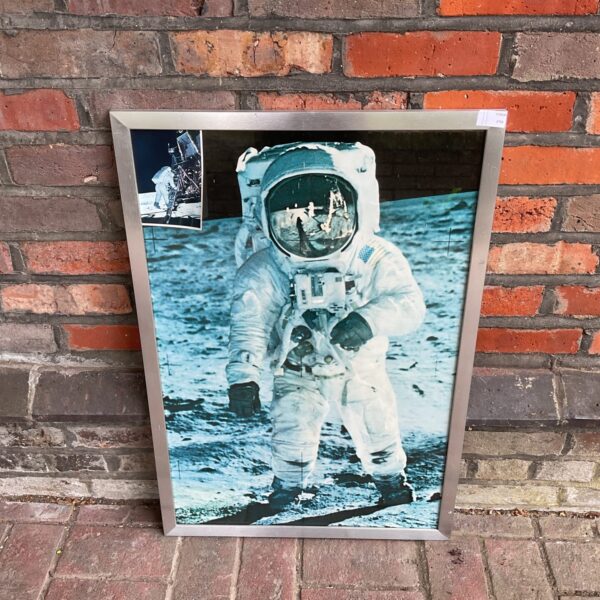 Vintage NASA moon walk print featuring an astronaut on the lunar surface.
