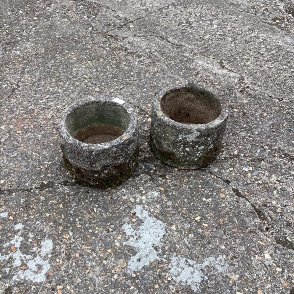 Weathered terracotta garden planters, a rustic pair for outdoor use.