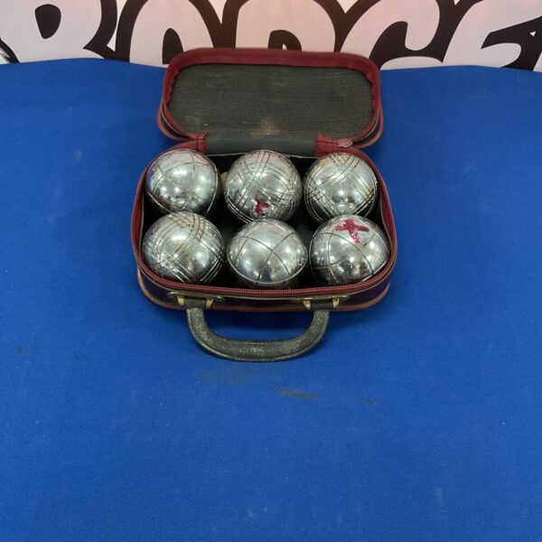Vintage Obut boules set with red case for pétanque.