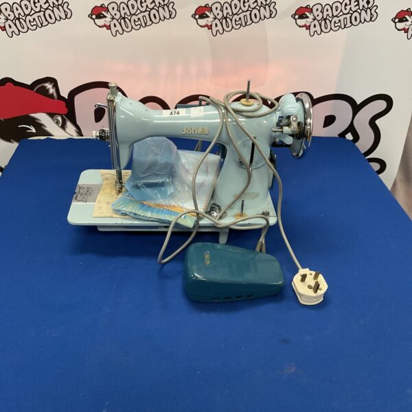 Vintage teal Jones Odel sewing machine for collectors.