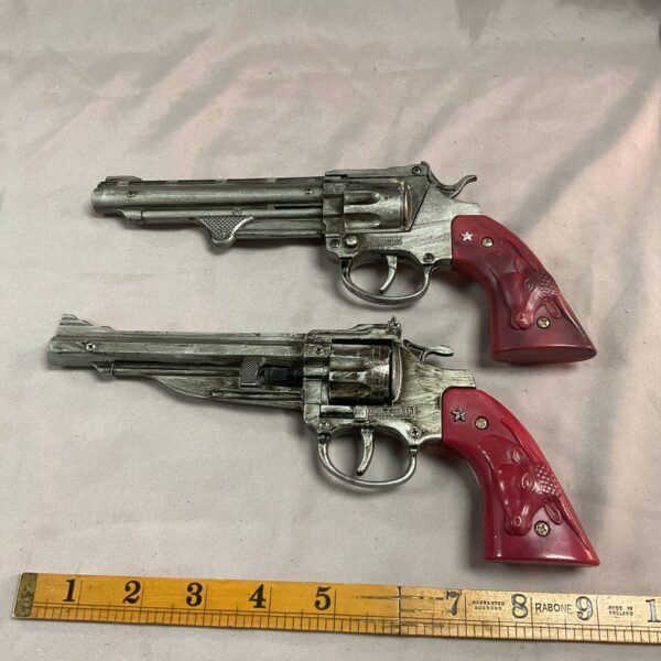 Vintage Wicke Germany cap gun, silver and red, collectible toy.