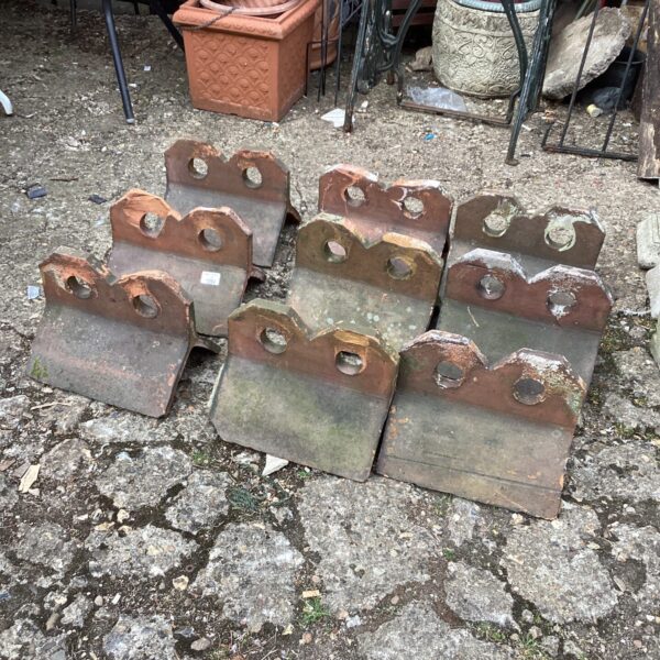 Lot of nine aged terracotta ridge tiles for garden or roof projects.