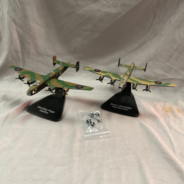 Detailed scale models of WW2 Halifax and Lancaster bombers on display.