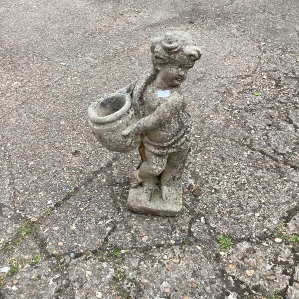 Vintage cherub garden planter statue with weathered patina.