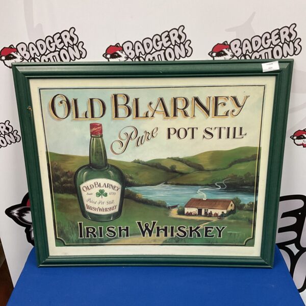 Vintage Old Blarney Irish Whiskey print in a decorative frame.
