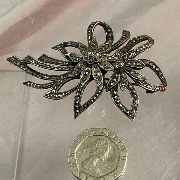 Vintage silver marcasite floral brooch, sparkling and detailed.