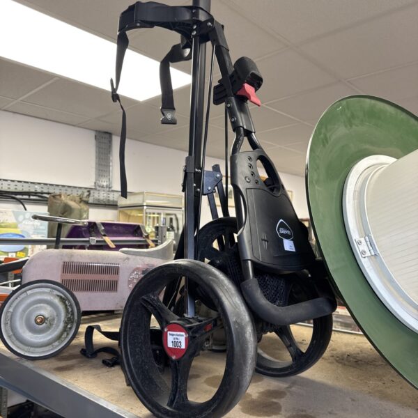 Portable Masters golf trolley for carrying golf equipment.