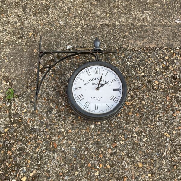Digital clock styled like a Paddington Station railway clock.