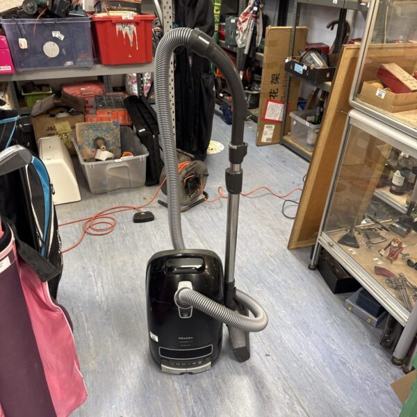Used Miele C3 cylinder vacuum cleaner for home cleaning.
