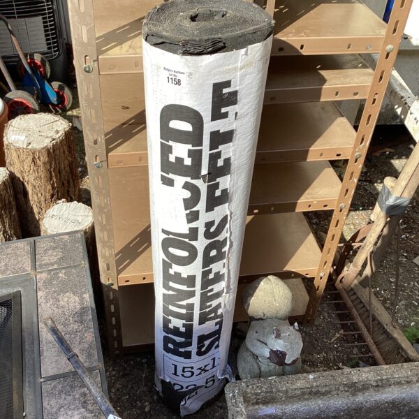 Close-up of a roll of reinforced roofing felt for DIY projects.