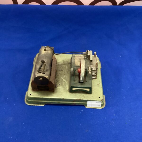 Vintage steam engine awaiting restoration, a collectible antique model.