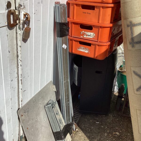 Used metal racking unit uprights for industrial storage.