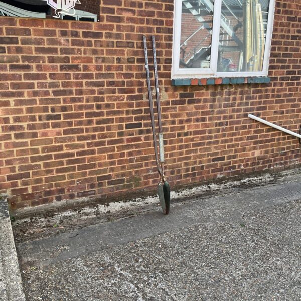 Long handled post hole digger spade for garden landscaping.