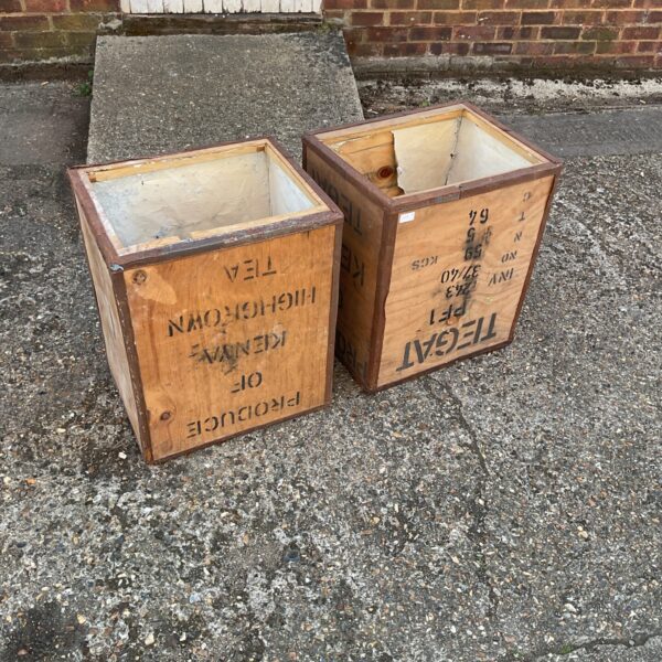 Pair of vintage wooden tea crates for storage and display.