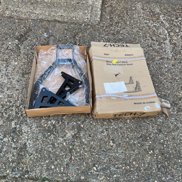 Tech-7 motorcycle paddock stand in original packaging.