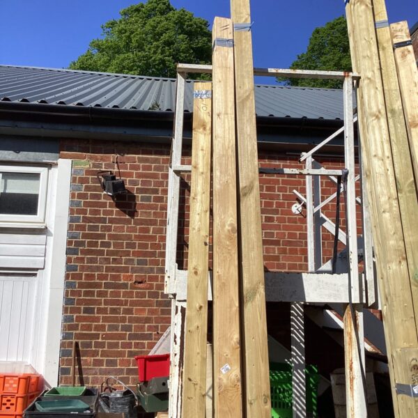 Outdoor view of timber bundles for construction and DIY projects.