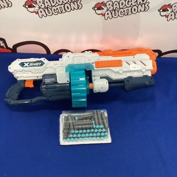 Brightly coloured XShot foam dart gun with rotating drum magazine.
