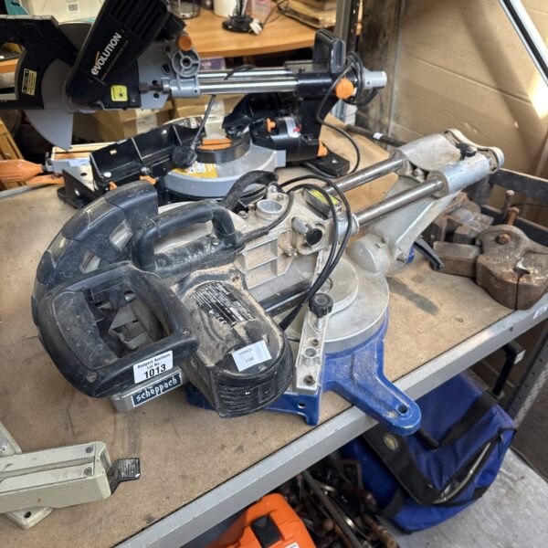 Scheppach chop saw for cutting metal in a workshop setting.