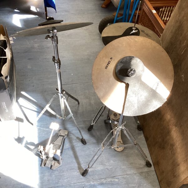 Used cymbal set with crash cymbal and adjustable stand.