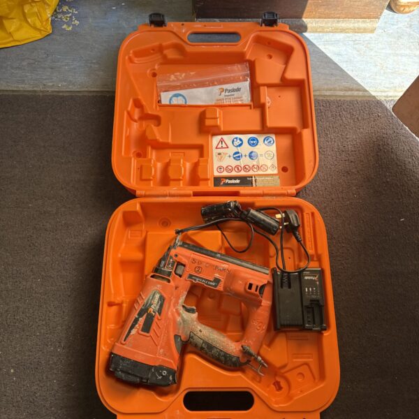 Paslode cordless electric stapler in a carrying case.