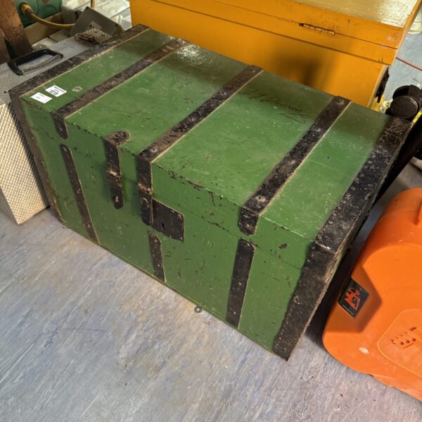 Large vintage iron banded chest for storage and display.