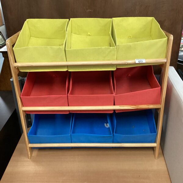 Colourful fabric storage boxes with wooden rack for playroom organisation.