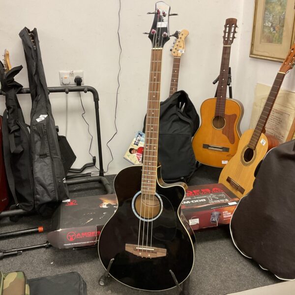 Black acoustic bass guitar with case, Swift music instrument.