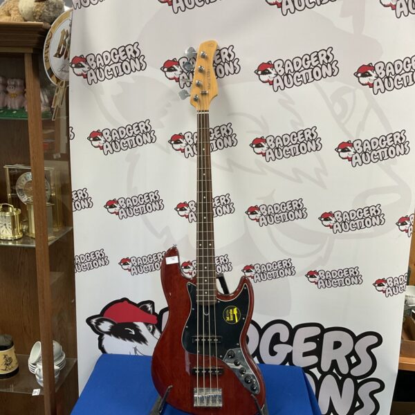 Red Marvus Miller V3 8 Series bass guitar for sale.