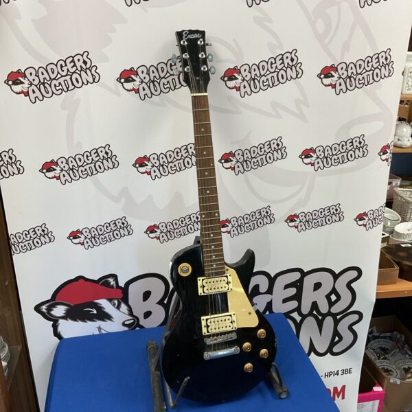 Black Encore electric guitar, vintage musical instrument for restoration.