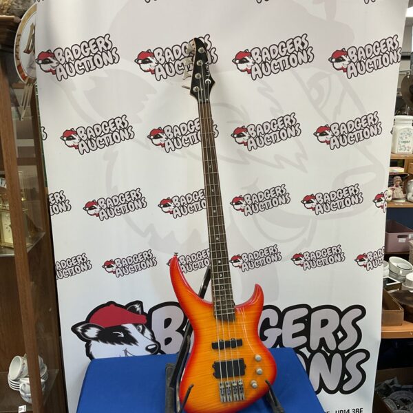 Red and orange Luna Crescent electric bass guitar.