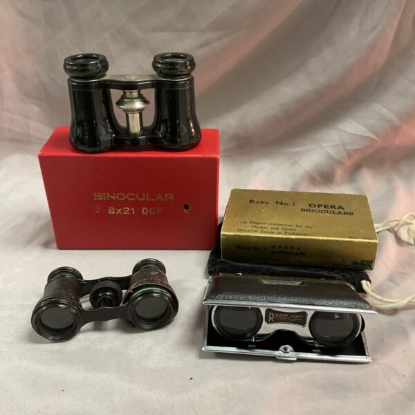 Pair of antique vintage opera glasses, brass and leather construction.