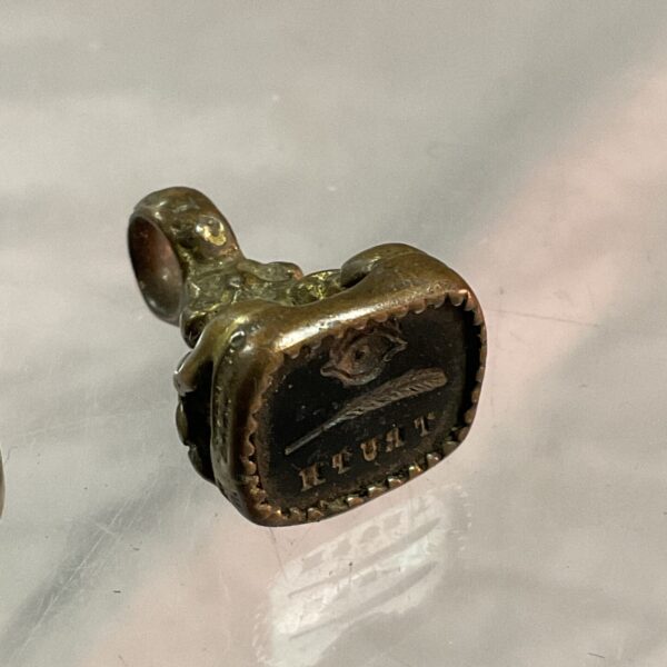 Antique brass masonic seal fob with all seeing eye detail.