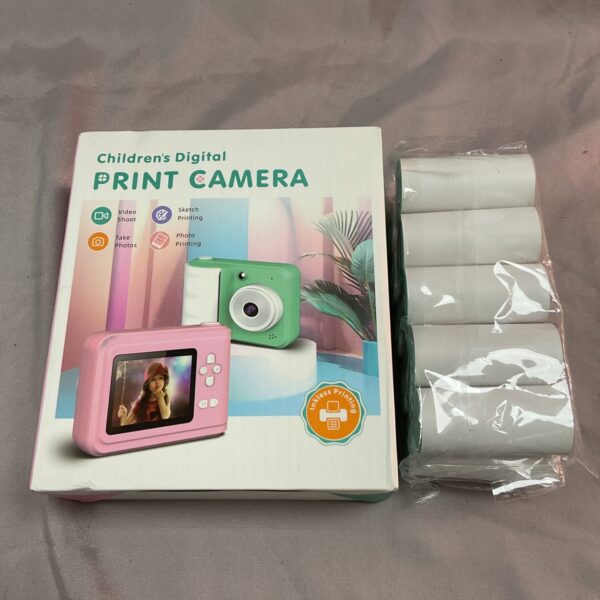 Colourful children’s digital print camera with spare rolls.