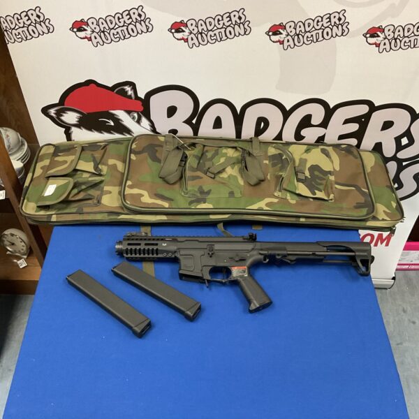 G&G Armament airsoft rifle with camo case for tactical games.