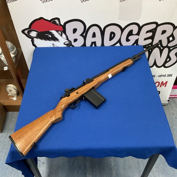 Side view of the M14 airsoft electric rifle with wooden stock.