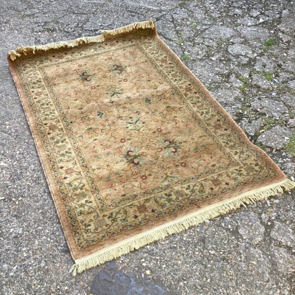 Detailed floral pattern on a New Zealand wool rug by Marks and Spencer.